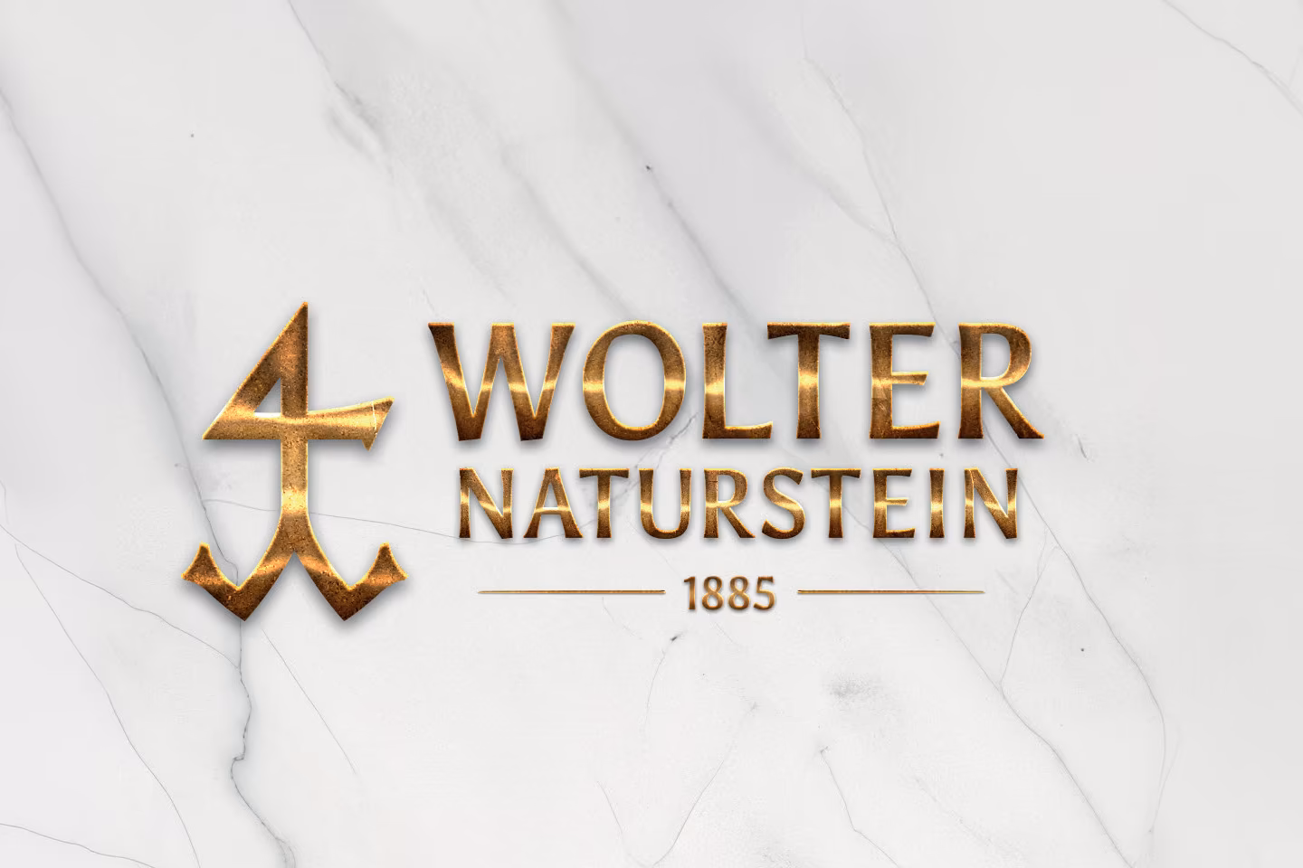 Logo von Wolter Naturstein mit Goldpr&auml;gung auf wei&szlig;em Marmor &ndash; Steinmetzbetrieb seit 1885 in Waren M&uuml;ritz