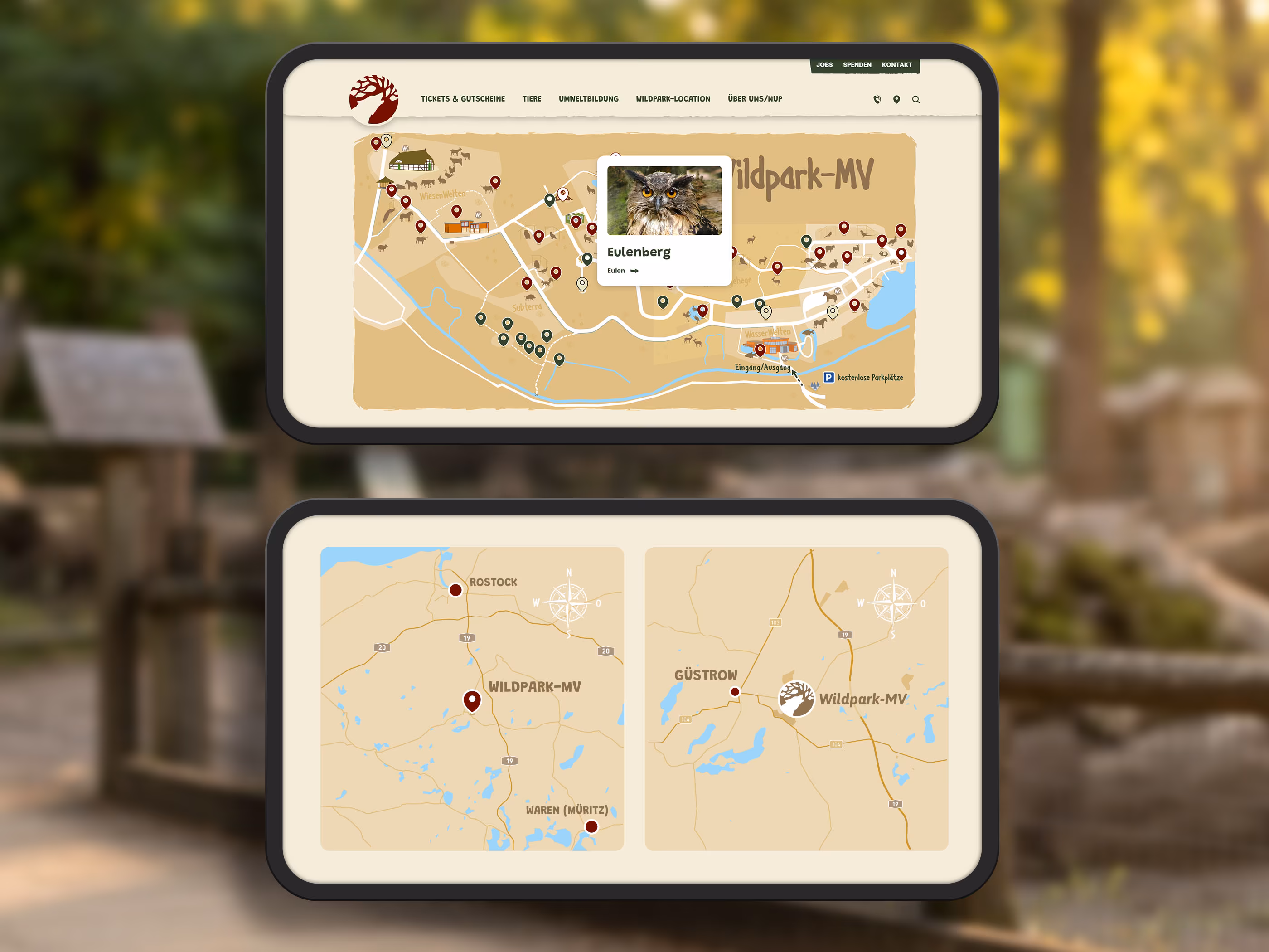 Interaktive Parkkarte und Anfahrtskarte des Wildpark-MV bei G&uuml;strow auf zwei Tablets